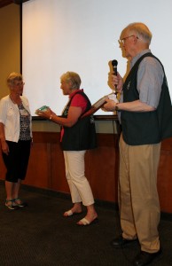 Lynda Pheasant accepts Fred's President's Award from Roxanne Lowe and Mike McKinnon